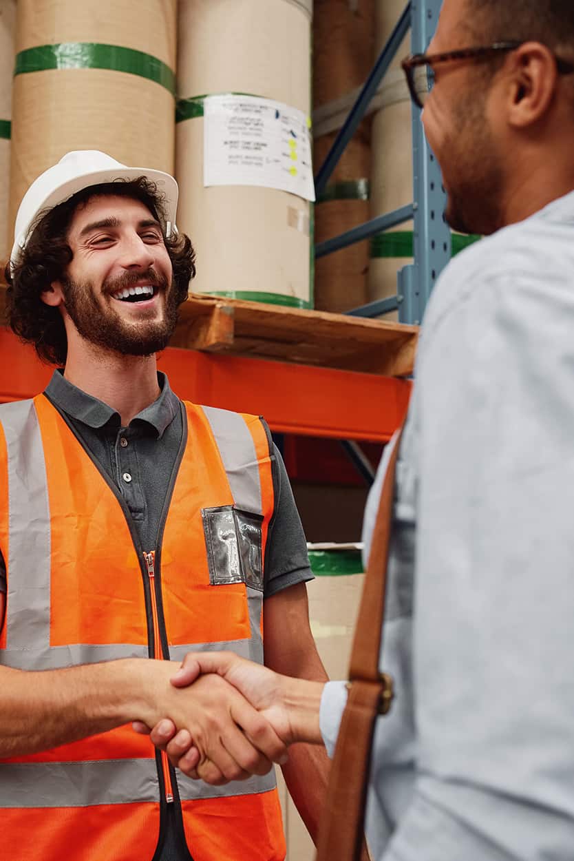 Warehouse Manager Shaking Hands With Business Partner | Brennan Equipment Services