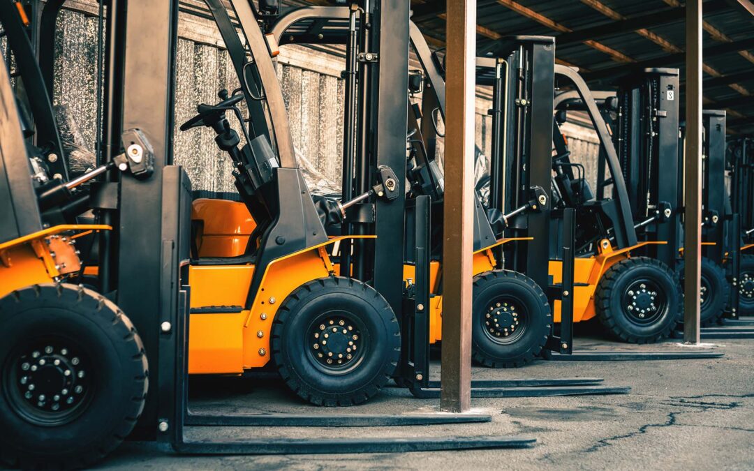Background Of A Lot Of Forklifts Reliable Heavy Loader Truck | Brennan Equipment Services